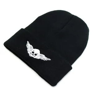 Black knit beanie with white embroidered skull and wings for autumn winter outdoor warmth