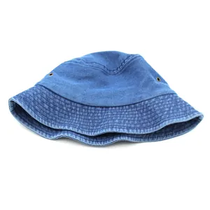 Detail of blue washed denim bucket hat showing metal eyelets and reinforced stitching