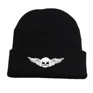 Black knit beanie with white skull and wings embroidery for outdoor winter warmth