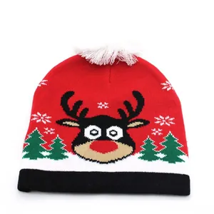 Festive knitted Christmas beanie with reindeer pattern, pom-pom and warm thermal lining