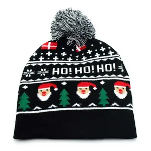 Close-up of knit Christmas beanie featuring HO! HO! HO! text and Santa Claus pattern