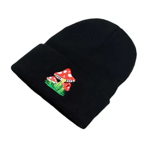 Black knit beanie featuring a red mushroom embroidery detail and folded cuff design