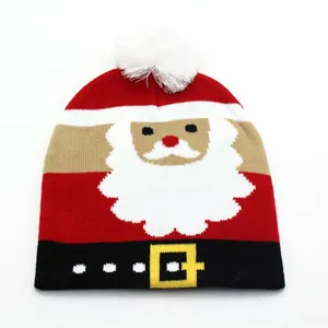 Knitted Christmas hat for kids featuring a red Santa Claus design and soft white pom-pom top