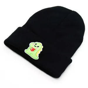Knitted black beanie with cute green dinosaur embroidery for autumn and winter warmth