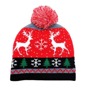 Knitted Christmas beanie with red reindeer and snowflake patterns for kids holiday warmth