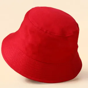 Close-up of a solid red bucket hat with reinforced stitching and thick cotton texture