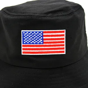 Black cotton bucket hat featuring embroidered US flag patch for sun protection