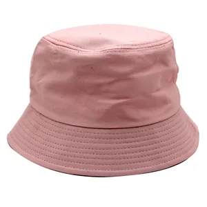 Detailed close-up of pink cotton bucket hat with parallel stitching on the wide brim
