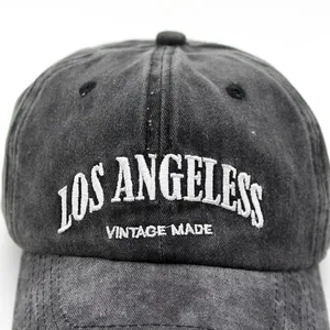 Vintage washed black denim baseball cap featuring white Los Angeles embroidery detail