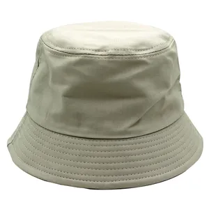 Detail of light beige twill bucket hat showing reinforced stitching on the wide brim