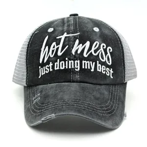 Close-up of distressed baseball cap featuring hot mess just doing my best embroidery