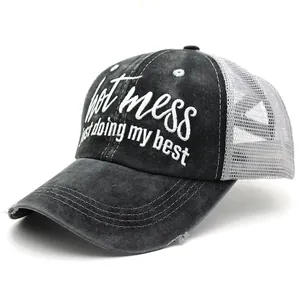 Detail of the high-density embroidery on this washed cotton ponytail baseball cap