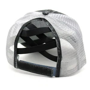 Detail view of criss-cross elastic ponytail bands and adjustable strap on mesh baseball cap