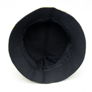 Double-sided bucket hat with lemon print showing internal black lining and stitching details