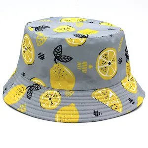 Detail of grey bucket hat with yellow lemon print showing stitching and fabric texture