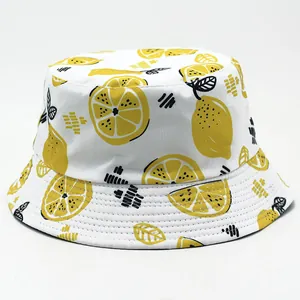 Detailed view of the yellow lemon pattern and stitching on a cotton bucket hat