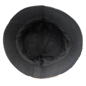Reversible bucket hat with astronaut spaceship print and reinforced black interior lining