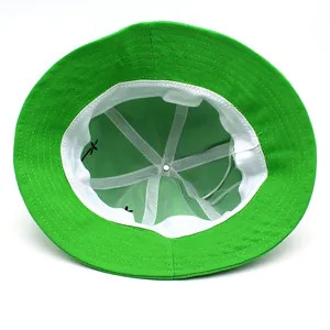 Interior view of green frog bucket hat featuring soft sweatband and mesh lining
