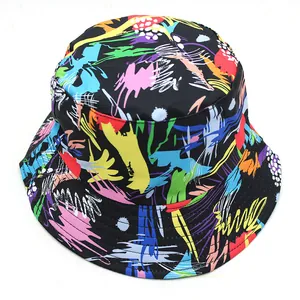 Close-up of a black bucket hat with colorful graffiti splash patterns and fine stitching