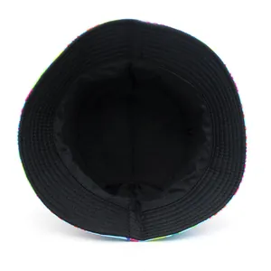 Reversible bucket hat with colorful graffiti pattern and black lining for outdoor sun protection