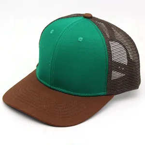 Detail view of trucker hat with green cotton front and brown mesh panels and brim