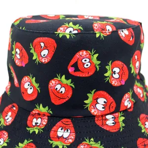 Reversible bucket hat with cartoon strawberry print and black cotton fabric for outdoors