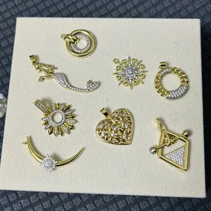 Golden mermaid heart and celestial pendant set with sparkling zircon crystal stones