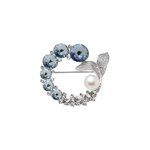 Elegant silver mermaid tail brooch with blue crystals and white pearl accents