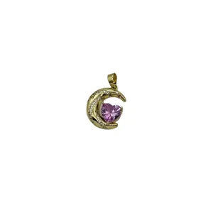 Gold moon pendant with pink heart gemstone and zircon accents on a white background