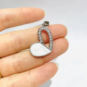 Elegant heart-shaped pendant with cubic zirconia inlay and white mother of pearl finish