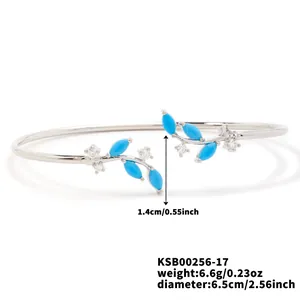 Detailed view of silver willow branch bracelet with blue stones and clear zircon accents