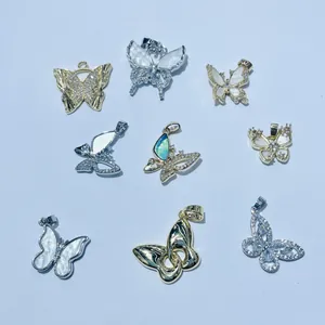 Collection of gold and silver butterfly pendants with zircons and mother-of-pearl inlays