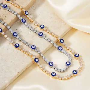 Tennis style evil eye necklace set in gold and silver with blue enamel charms