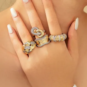 Two-tone retro wide band rings with gold finish and pave crystals on hand
