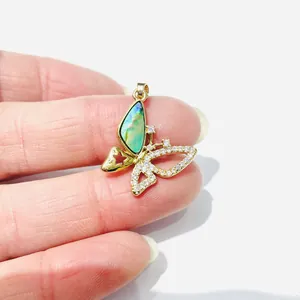Exquisite gold-plated butterfly pendant with iridescent green inlay and white rhinestones