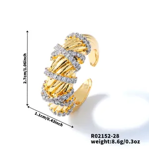 Detail of two-tone open ring with gold base and crisscross silver pave set rhinestones