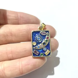 Gold rectangular celestial pendant with starry blue enamel and colorful gemstone inlay