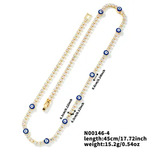 Detail of gold evil eye tennis necklace with blue stones and dimensions 45cm 15.2g