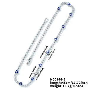 Detail of 45cm tennis chain with heart evil eye charms and CZ stones in silver finish