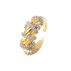 Elegant two-tone twisted open ring with gold finish and shimmering pave zircon bands