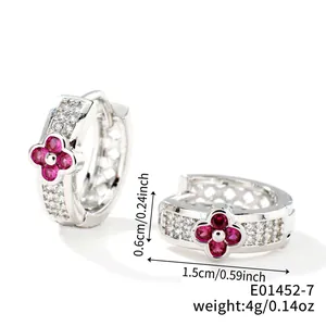Detailed size view of round four-leaf clover earrings with pink zircon and hollow patterns