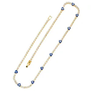 Golden Evil Eye heart necklace with white zircon pavé chain on white background