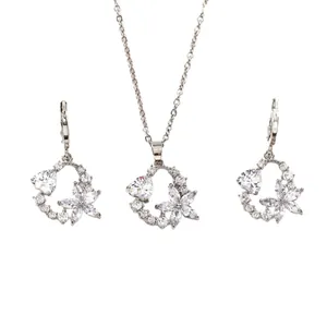 Elegant silver butterfly necklace and stud earrings set with sparkling crystals on white base