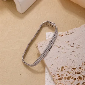 Luxury three-row rhinestone tennis bracelet in silver finish with metal folding clasp