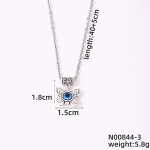 Collar mariposa plateado con colgante de ojo azul, dimensiones detalladas 40+5cm