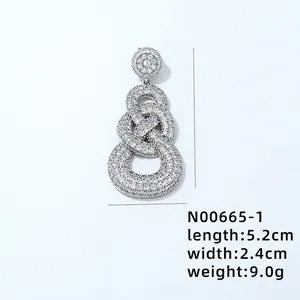 Macro shot of silver-tone teardrop earrings with dimensions 5.2cm by 2.4cm and weight 9.0g