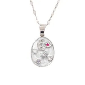 Celestial silver necklace with moon star and eye pendant featuring white enamel and zircons