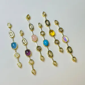 Set of six long geometric gold charms with colorful gemstones and white zircon accents