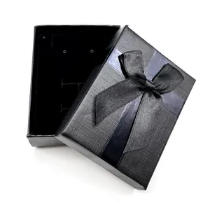 Elegant black jewelry gift box with textured finish and black silk ribbon bow for necklaces
