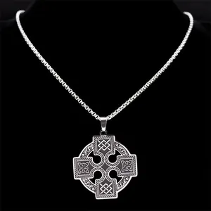 Detail of Celtic cross pendant on wheat chain displayed on black mannequin